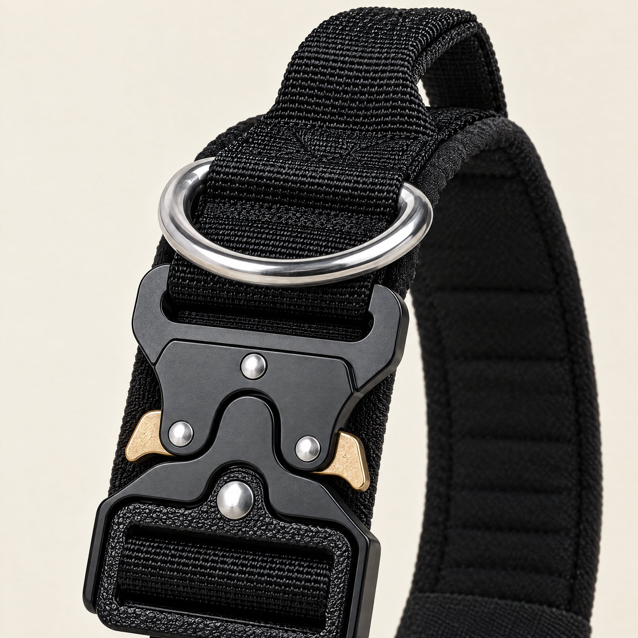 Close-up of the Wandra Crag Collar metal quick-release buckle, steel D-ring and grab handle